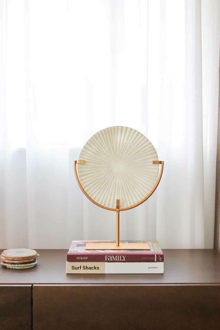 white ribbed disc on stand