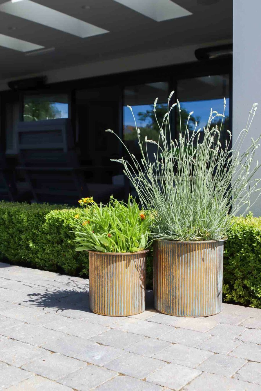 two bronze metal planters