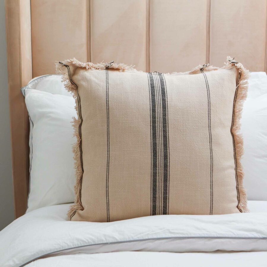 beige striped fringe cushion