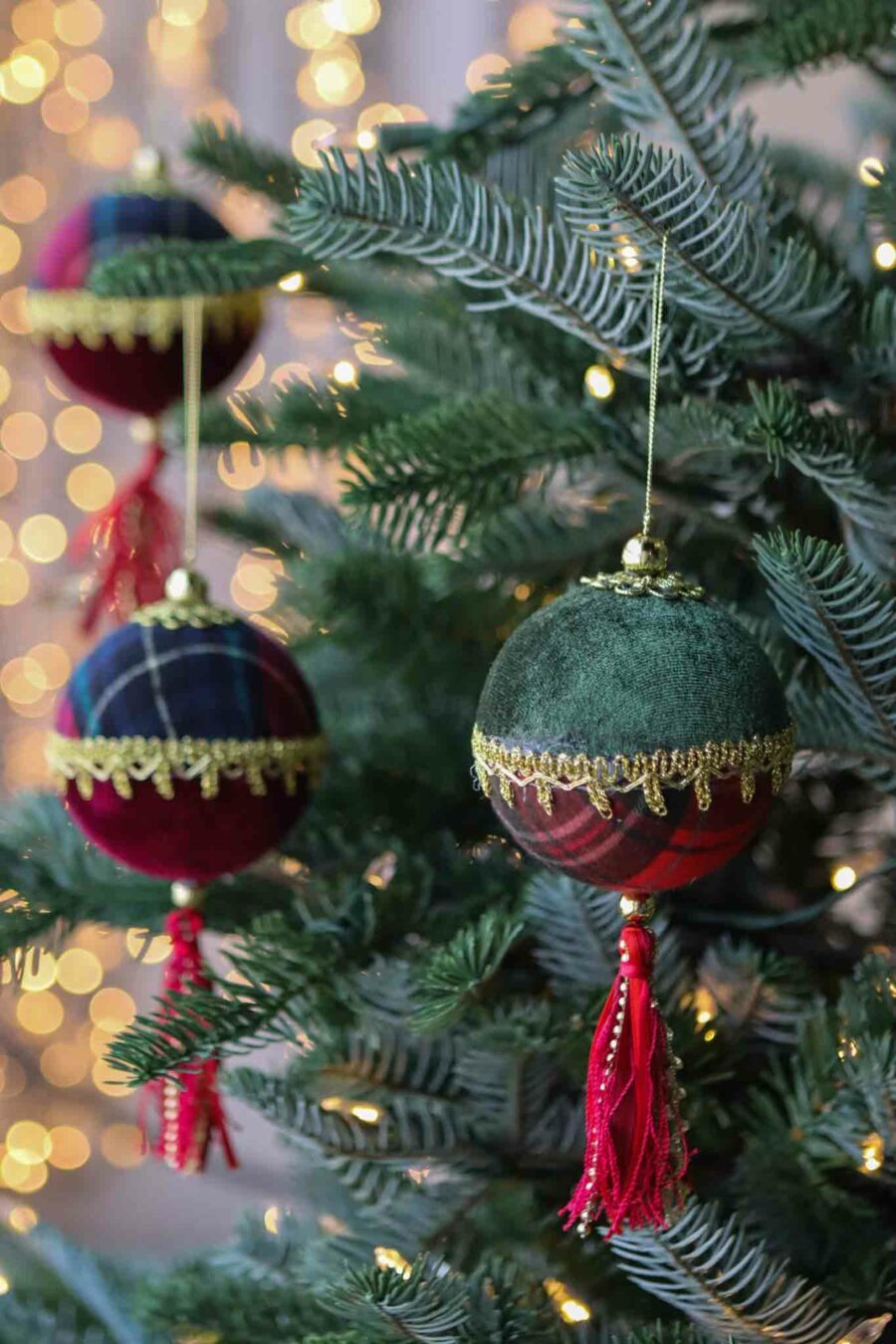six traditional red and green plaid baubles with tassel