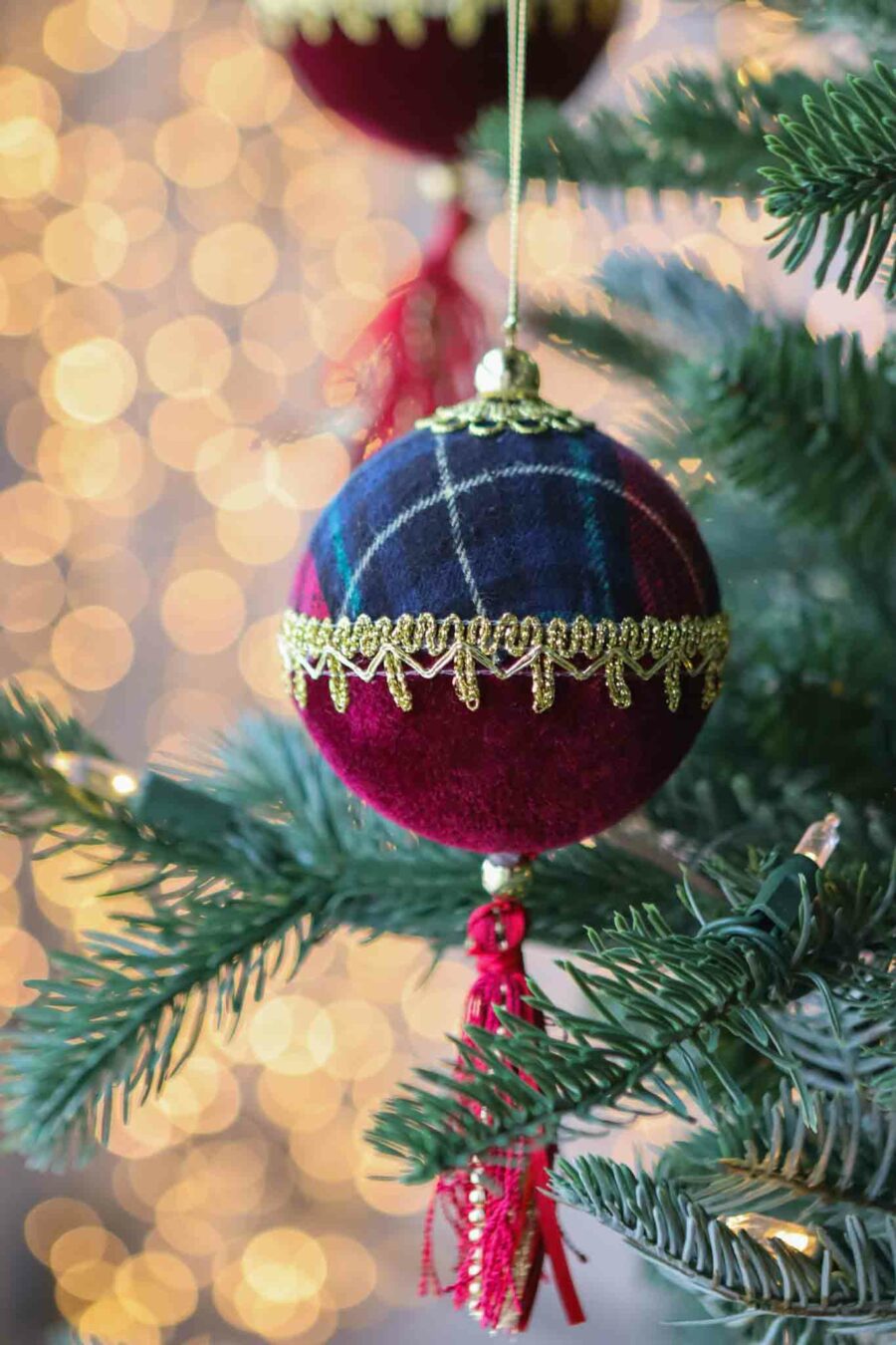 six traditional red and green plaid baubles with tassel
