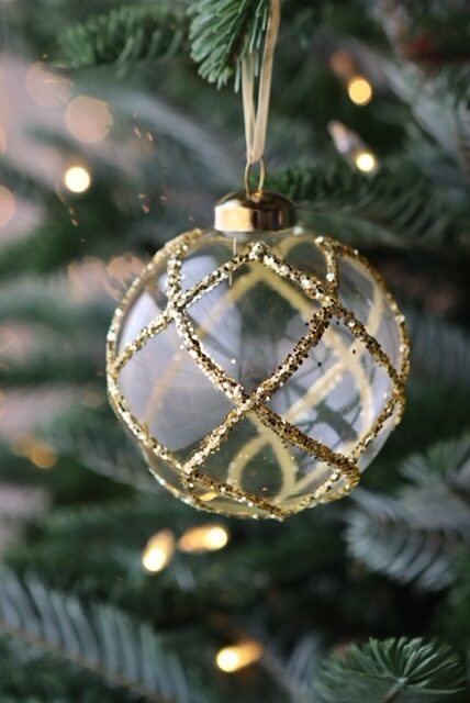 six clear and gold glitter glass baubles