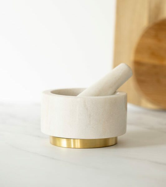marble and brass pestle and mortar
