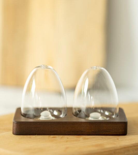glass salt and pepper shaker with wooden acacia board