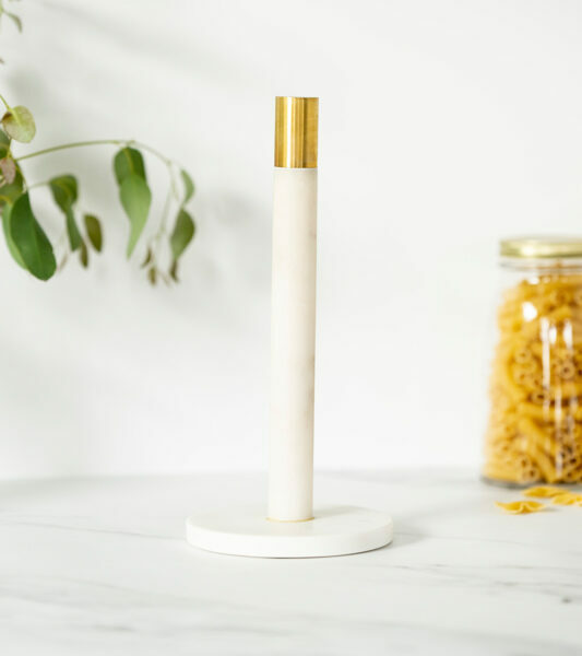 white marble and brass kitchen paper stand