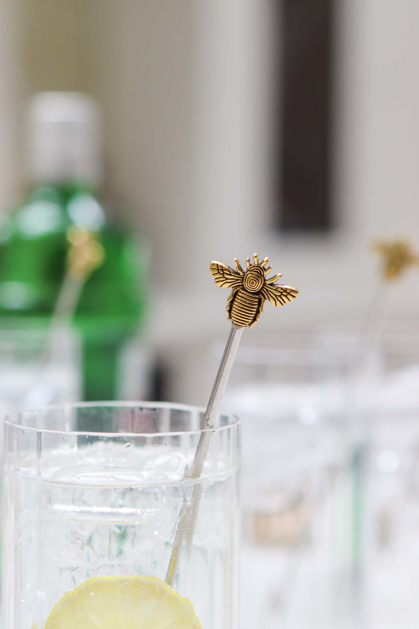 four gold bee stirrers
