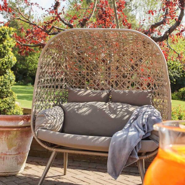 standing paloma wicker double snug egg chair sand
