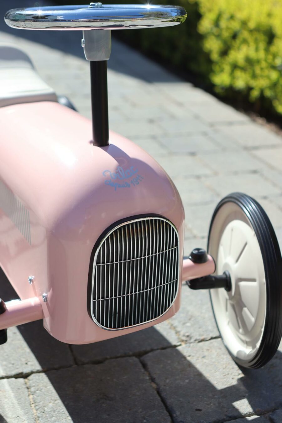 classic vintage ride on car in pink