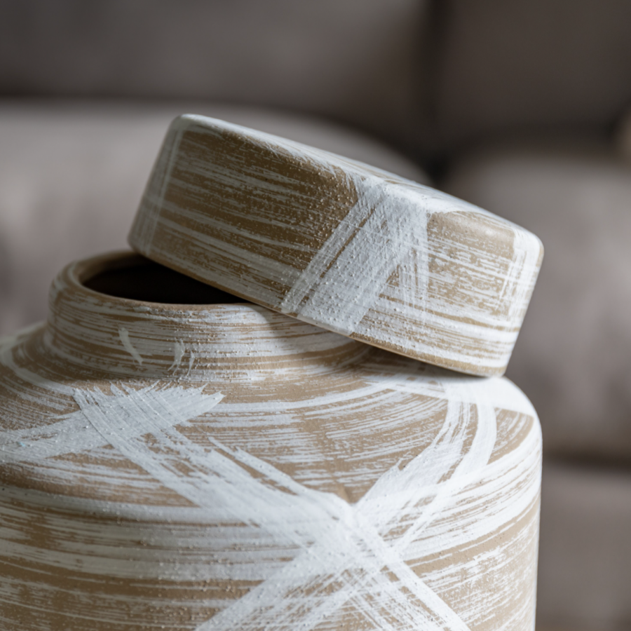 brown and white stoneware jar